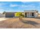 Newly renovated home with modern facade, two-car garage, and desert landscaping at 3301 E Larkspur Dr, Phoenix, AZ 85032