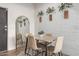 Dining area features a table for four and a full-length mirror at 3302 N 7Th St # 133, Phoenix, AZ 85014