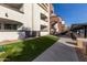 Exterior of the building, showing a walkway, landscaping, and parking at 3302 N 7Th St # 133, Phoenix, AZ 85014