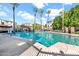 Inviting community pool with lounge chairs and palm trees at 3302 N 7Th St # 366, Phoenix, AZ 85014