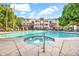 Community pool and spa with surrounding lounge chairs at 3302 N 7Th St # 366, Phoenix, AZ 85014