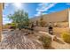 Landscaped backyard featuring a fire pit and grill at 33612 N 24Th Dr, Phoenix, AZ 85085