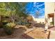 Landscaped backyard with a fire pit and garden area at 33612 N 24Th Dr, Phoenix, AZ 85085