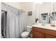 Bathroom with a shower/tub combo and wood vanity at 33612 N 24Th Dr, Phoenix, AZ 85085