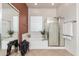 Clean bathroom featuring a tub, separate shower, and a glass block window at 33612 N 24Th Dr, Phoenix, AZ 85085