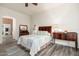 Bright bedroom with wood-look floors and a comfortable bed at 33612 N 24Th Dr, Phoenix, AZ 85085