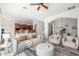 Bright living room features modern decor, ceiling fan, and flows into the kitchen and dining area at 33612 N 24Th Dr, Phoenix, AZ 85085