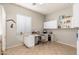 Home office with a large desk and built in shelving at 33612 N 24Th Dr, Phoenix, AZ 85085