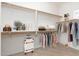 Organized walk-in closet with shelving and hanging space for clothes and accessories at 33612 N 24Th Dr, Phoenix, AZ 85085