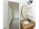 Bathroom with vanity, sink, and view into another room at 3554 W Royal Palm Rd, Phoenix, AZ 85051