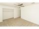 Spacious bedroom with closet and ceiling fan at 3554 W Royal Palm Rd, Phoenix, AZ 85051