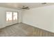 Bright bedroom with plush carpet and sliding door to patio at 3554 W Royal Palm Rd, Phoenix, AZ 85051