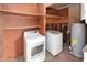 Laundry room with washer, dryer, and extra shelving at 3554 W Royal Palm Rd, Phoenix, AZ 85051