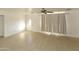 Bright living room featuring tile floors and a ceiling fan at 3554 W Royal Palm Rd, Phoenix, AZ 85051