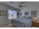 Guest bedroom with queen-size bed and ceiling fan at 35849 N 3Rd St, Phoenix, AZ 85086