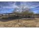 Horse stables with covered area and desert landscape at 35849 N 3Rd St, Phoenix, AZ 85086