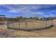 Octagonal shaped riding arena made of sand and metal fencing at 35849 N 3Rd St, Phoenix, AZ 85086