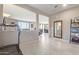 Bright entryway with a large mirror and views into the living room and hallway at 36811 N El Morro Trl, San Tan Valley, AZ 85140