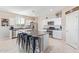 Modern kitchen with island, stainless steel appliances, and white shaker-style cabinets at 36811 N El Morro Trl, San Tan Valley, AZ 85140