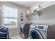 Laundry room with washer, dryer, and shelving for storage at 36811 N El Morro Trl, San Tan Valley, AZ 85140