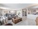 Open living space showcasing a neutral color palette and views into the kitchen and dining area at 36811 N El Morro Trl, San Tan Valley, AZ 85140