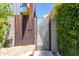 Modern building exterior with unique metal gate and landscaping at 3707 N Marshall Way # 3, Scottsdale, AZ 85251