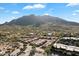 The aerial view of Carefree, Arizona shows homes in the desert with stunning mountain backdrops at 37222 N Tom Darlington Dr # 11, Carefree, AZ 85377