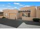 Exterior view of a desert style home with one car garage and desert landscaping at 37222 N Tom Darlington Dr # 11, Carefree, AZ 85377