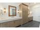 Elegant bathroom with double vanity, large mirror, and a separate shower at 3750 N Piedra Cir, Mesa, AZ 85207