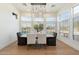 Bright dining room with large windows and a stunning light fixture at 3750 N Piedra Cir, Mesa, AZ 85207