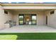 Covered patio with built-in grill and sliding glass doors leading inside at 3750 N Piedra Cir, Mesa, AZ 85207