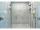 Large walk-in shower with marble tile, dual shower heads, and glass enclosure at 3750 N Piedra Cir, Mesa, AZ 85207