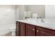 Clean bathroom with dark wood vanity and bathtub at 3905 S 185Th Ln, Goodyear, AZ 85338