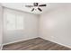 Bedroom featuring wood-look floors and ceiling fan at 3905 S 185Th Ln, Goodyear, AZ 85338