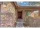 Front door entry with stone accents and a walkway at 3905 S 185Th Ln, Goodyear, AZ 85338