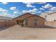 Tan house exterior with a covered patio at 3905 S 185Th Ln, Goodyear, AZ 85338