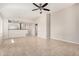 Bright living room featuring tile floors and a ceiling fan at 3905 S 185Th Ln, Goodyear, AZ 85338