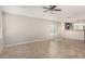 Spacious living room with tile floors and a ceiling fan at 3905 S 185Th Ln, Goodyear, AZ 85338