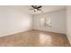 Simple bedroom with ceiling fan and tile floors at 4170 E Winged Foot Pl, Chandler, AZ 85249