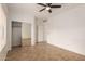 Well-lit bedroom with mirrored closet and tile floors at 4170 E Winged Foot Pl, Chandler, AZ 85249