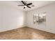 Spacious bedroom featuring tile floors and a ceiling fan at 4170 E Winged Foot Pl, Chandler, AZ 85249