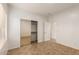 Bright bedroom with mirrored closet and tile floors at 4170 E Winged Foot Pl, Chandler, AZ 85249