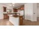 Kitchen with granite countertop island and wood cabinets at 4170 E Winged Foot Pl, Chandler, AZ 85249