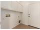 Laundry room with upper cabinets and tile floor at 4170 E Winged Foot Pl, Chandler, AZ 85249