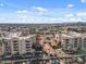 Aerial view of a community with multiple buildings, parking, and landscaping at 4200 N Miller Rd # 526, Scottsdale, AZ 85251