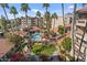 Aerial view of community with pool and surrounding buildings at 4200 N Miller Rd # 526, Scottsdale, AZ 85251