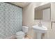 Bathroom with pedestal sink and shower at 4200 N Miller Rd # 526, Scottsdale, AZ 85251