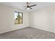 Bright bedroom with ceiling fan and carpet at 4200 N Miller Rd # 526, Scottsdale, AZ 85251