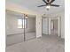 Bedroom with mirrored closet and ceiling fan at 4200 N Miller Rd # 526, Scottsdale, AZ 85251