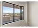 Bedroom with large window showcasing a city view at 4200 N Miller Rd # 526, Scottsdale, AZ 85251